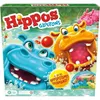 The image shows the front of a board game box featuring cartoon hippos in water. Podgląd zdjęcia produktu
