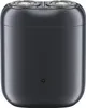 A close-up, front-facing studio shot of a black electric shaver with two rotary heads. Náhled obrázku produktu