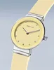 A close-up studio shot of a Bering women's watch with a yellow dial and strap. Produktbild-Vorschau