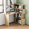 A corner desk with a bookshelf unit, set up in a room with a window and a green wall. Voir les images du produit