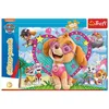 The image shows the packaging of a Paw Patrol glitter puzzle. The packaging features cartoon characters from the Paw Patrol series, specifically Skye, and other pups, in a vibrant and playful scene. The puzzle itself is depicted on the front of the box, wi Produktbild-Vorschau