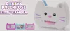 A Gabby's Dollhouse Kitty Camera toy is shown with three smaller images of the toy in different colors below it. The Gabby's Dollhouse logo and product name are displayed on the left side of the image. Produktbild-Vorschau