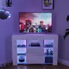 A modern white TV stand with LED lighting, displaying a TV and various electronic accessories. Voir les images du produit