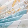 A close-up shot of folded fabric with a floral pattern. Náhľad obrázku produktu
