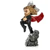 A figurine of Thor from Avengers: Endgame, posed dynamically on a rocky base, holding his hammer. Náhled obrázku produktu