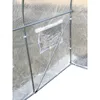 Close-up view of a greenhouse cover with a small window. Voir les images du produit