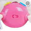 Close-up of a pink interactive toy with colorful buttons and a switch. Anteprima dell’immagine prodotto