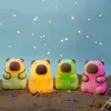 Four bear-shaped night lights are sitting on a sandy beach with fairy lights in the background. Náhľad obrázku produktu