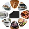 A collage of kitchen appliances and food preparation scenes, with a black mat in the center. Náhled obrázku produktu