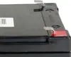 Close-up view of the top corner of a black battery. Produktbild-Vorschau