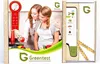 A product box for a Greentest device, showing two young women in a kitchen setting. Produktbild-Vorschau