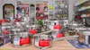 A display of stainless steel cookware in a retail store. Produktbild-Vorschau