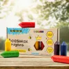 A box of Medenka Junior beeswax crayons is displayed on a wooden surface with a blurred natural background. Náhľad obrázku produktu