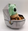 A plush toy of Baby Yoda from Star Wars is sitting in its hover crib. Produktbild-Vorschau