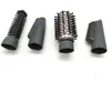 Four hair styling attachments are laid out on a white surface. Podgląd zdjęcia produktu