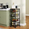 A kitchen cart filled with fruits and jars is placed next to a kitchen counter with appliances. Podgląd zdjęcia produktu