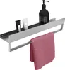 A bathroom shelf with toiletries and a towel. Anteprima dell’immagine prodotto