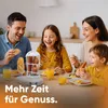 A family is enjoying breakfast together, with the hot dog maker and egg cooker prominently displayed on the table. Podgląd zdjęcia produktu