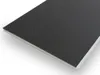 A close-up, angled view of a single plank of SPC click vinyl flooring with a textured dark gray surface and a white edge. Produktbild-Vorschau
