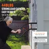 An elderly woman is using a black metal handrail attached to the side of a house. Náhled obrázku produktu