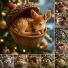 A collage of Christmas ornaments shaped like acorns, each containing a sleeping woodland animal. The main image features a fawn in an acorn. The background is a blurred Christmas tree with lights. Produktbild-Vorschau