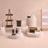 A collection of bathroom accessories displayed on pedestals. Voir les images du produit