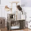 A multi-level cat tree with a built-in litter box enclosure, featuring two cats interacting with the structure. Podgląd zdjęcia produktu