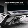 A close-up of a phone case with a ring stand, placed on a surface with a laptop and headphones in the background. Produktbild-Vorschau