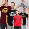 Four men wearing Lonsdale London t-shirts in different colors. Produktbild-Vorschau