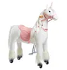 A white plush unicorn toy with a pink saddle and bridle, standing on a white background. Produktbild-Vorschau