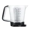 A clear measuring jug with ml and oz markings, with a black base and handle. Náhľad obrázku produktu