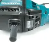 A close-up view of a power tool, likely a demolition hammer, showing its handle and casing. Anteprima dell’immagine prodotto