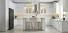 A modern, white kitchen with a central island and bar stools. Produktbild-Vorschau