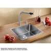 A modern kitchen sink with a faucet, soap dispenser, and pomegranates on a wooden countertop. Produktbild-Vorschau