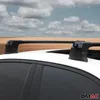 A close-up view of a car's roof rack system against a backdrop of a field and sky. Voir les images du produit
