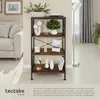 A bookshelf with decorative items on it, next to a sofa and a floor lamp. Produktbild-Vorschau
