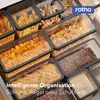 A collection of Rotho food storage containers filled with various dry goods like pasta, cereal, coffee beans, and seeds, neatly arranged in a drawer. Produktbild-Vorschau