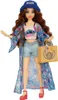 A doll dressed in a Stitch-themed outfit, holding a bag. Voir les images du produit
