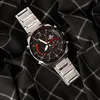 A close-up, top-down view of a Casio Edifice watch placed on a black fabric with a white checkered pattern. Náhled obrázku produktu