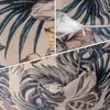 A collage of close-up images showing the fabric pattern and zipper of a pouf/ottoman. Produktbild-Vorschau