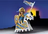 A toy knight on a horse with a castle in the background. Podgląd zdjęcia produktu