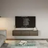 A modern living room with a wall-mounted TV displaying credits, a wooden TV stand, a glass coffee table with a notebook and pen, and a sofa. Voir les images du produit