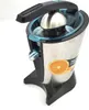 A close-up studio shot of a stainless steel electric citrus juicer with a black handle and base, set against a white background. An orange slice is visible on the side of the juicer. Podgląd zdjęcia produktu