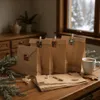Christmas advent calendar bags on a wooden table with festive decorations. Produktbild-Vorschau