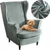 A grey wingback chair with a small brown dog sitting on it. A close-up of the fabric is shown in the top right corner. Podgląd zdjęcia produktu
