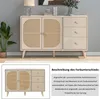 A beige sideboard with rattan doors and drawers, displayed in a room setting with a plant and lamp. Produktbild-Vorschau