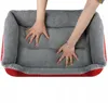 Hands pressing into a soft dog bed. Anteprima dell’immagine prodotto