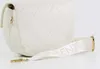 A white quilted handbag with a white strap with the word VALENTINO embossed on it. Anteprima dell’immagine prodotto