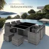 A rattan dining set with cushions is placed on a patio next to a swimming pool with a view of the ocean and a modern house. Náhled obrázku produktu