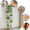 A multi-tiered plant stand with several potted plants displayed on it, set against a plain wall with curtains in the background. Several close-up insets highlight product features and assembly details. Podgląd zdjęcia produktu